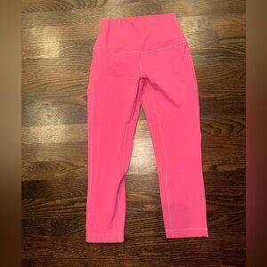 Lululemon hot pink cropped leggings. Never worn. Size 4.